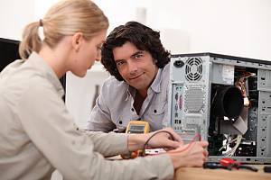 Employee with client going through ITAD e-waste process 
